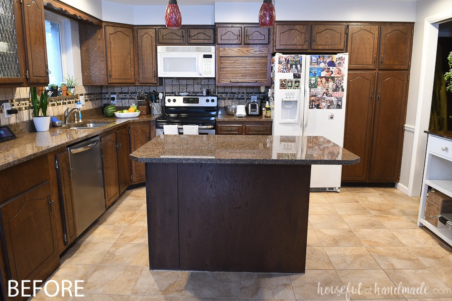 Face on view of the before of the dark and dated kitchen.