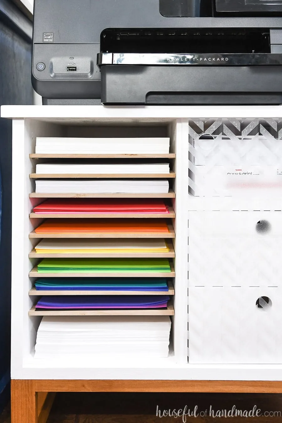 Close up of the paper storage shelves in the printer table. 