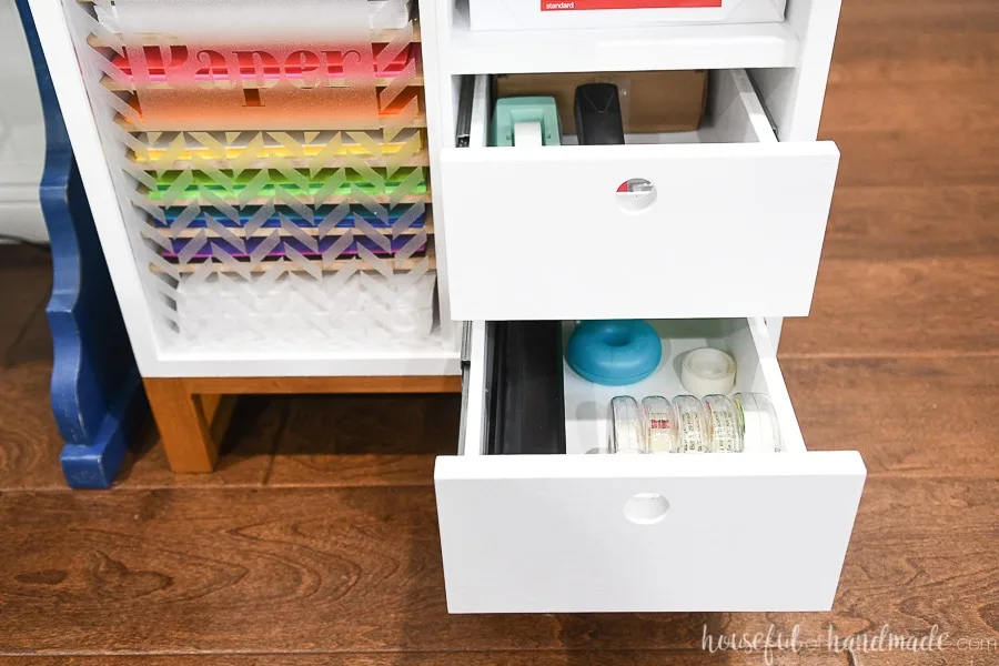 Small printer table with 2 drawers open to show storage. 