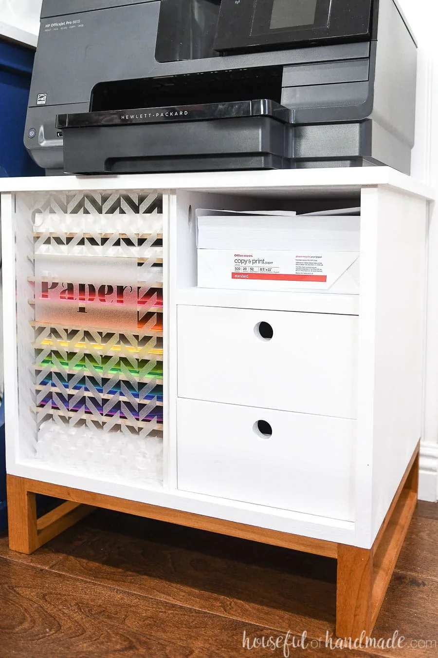 White printer table with printer on top.