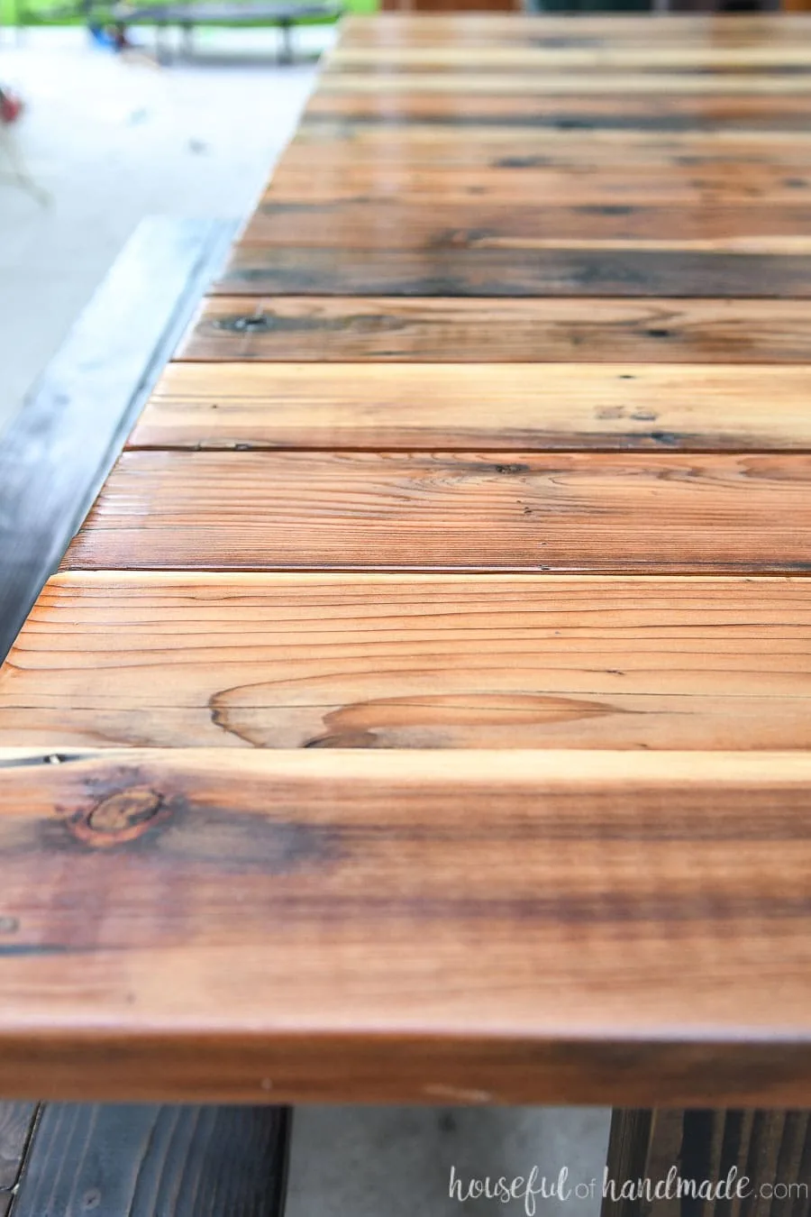 Close-up of reclaimed redwood picnic table top.