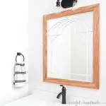 DIY Window frame mirror in bathroom above the vanity.