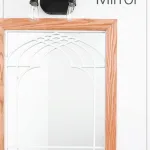 Window frame mirror in bathroom with open cathedral arch area.