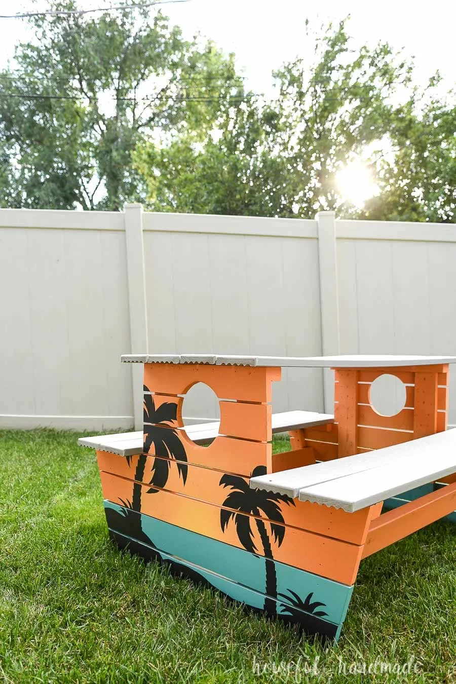 Painted picnic table to look like a tropical sunset with an ombre painted with a paint sprayer. 