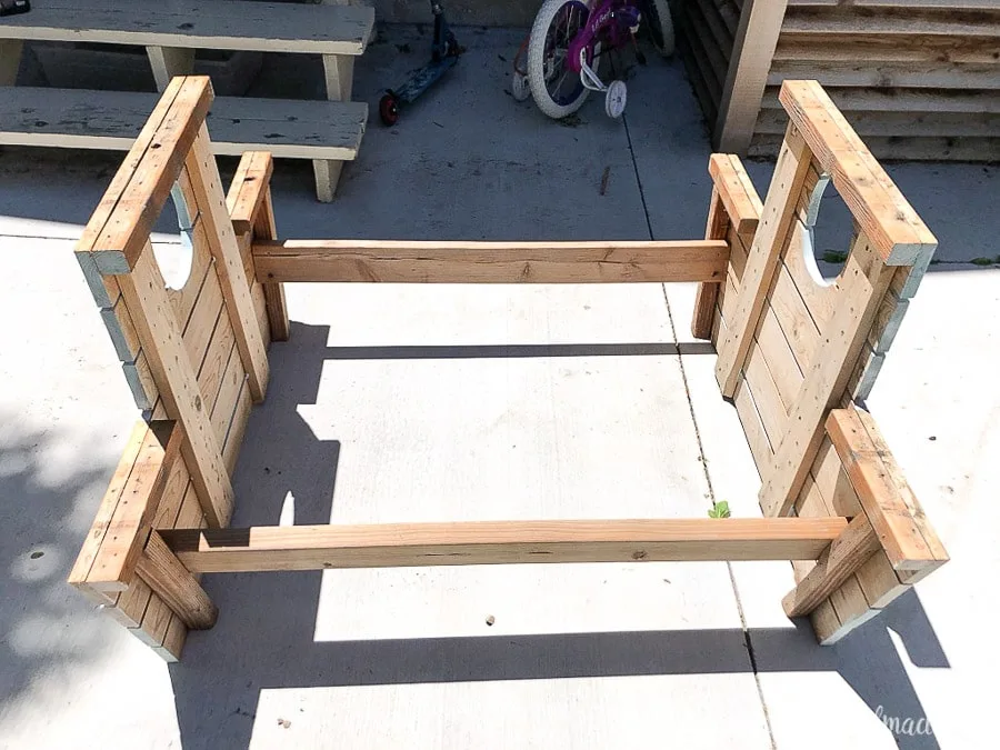 Old boat picnic table with top and seat boards removed.