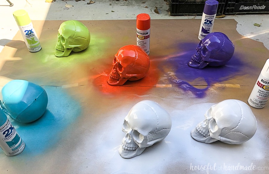 Plastic skulls painted a variety of colors ready to be decorated into sugar skulls. 