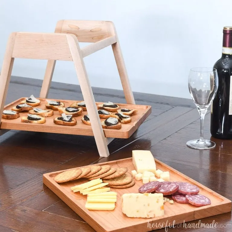 Wood tiered serving on a table with the top tray removed from the serving stand.