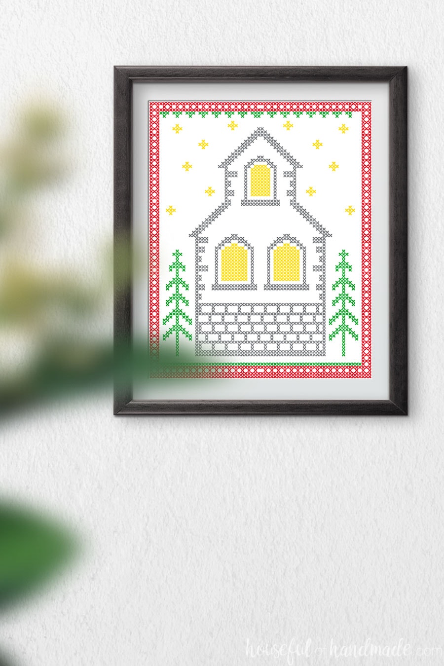 Printable art that looks like a cross-stitched Christmas church. 