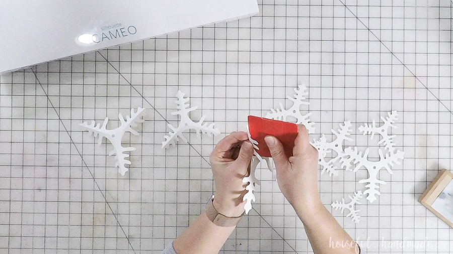 Pinching the cut out branches to give it dimension.