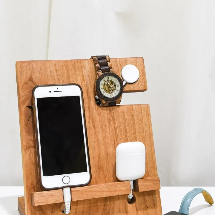 DIY wood valet that holds an iPhone, Apple Watch and AirPods with an Apple Watch charger built in.