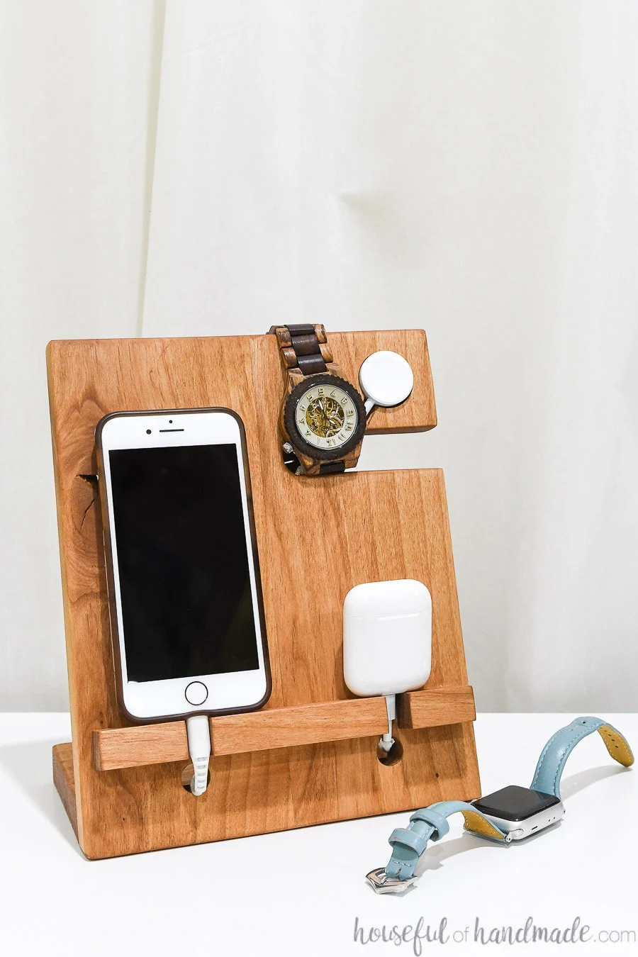 DIY wood valet that holds an iPhone, Apple Watch and AirPods with an Apple Watch charger built in. 