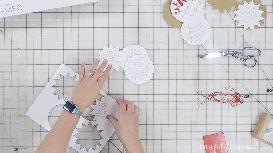 Cutting out the cross-stitch ornament templates on the Silhouette Cameo.