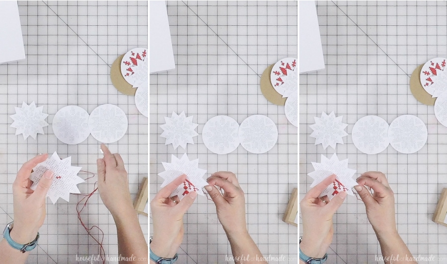 Stitching the cross-stitch snowflake design on the paper ornaments.