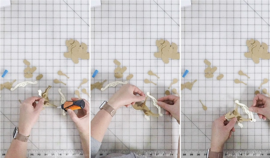 Glueing the rocker to the bottom of the paper horse ornaments.