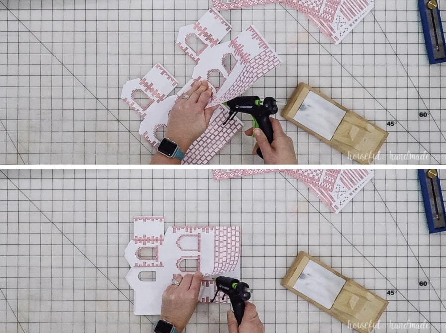 Glueing the tabs on the sides of the houses to make a box.