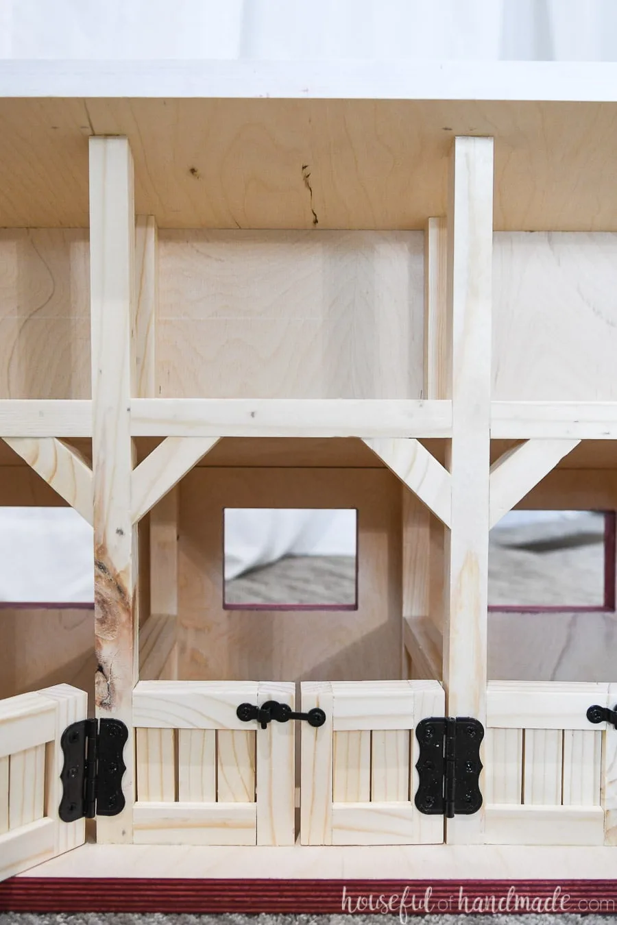 Close up view of the stalls and loft in the barn dollhouse.