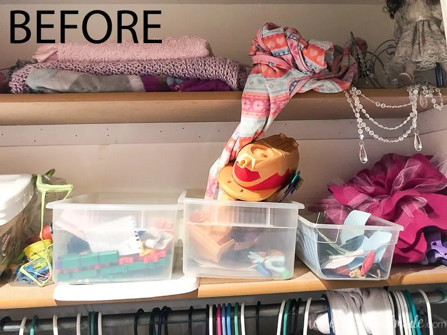 Close up of the current shelves in the closet before the $100 kids closet makeover. 