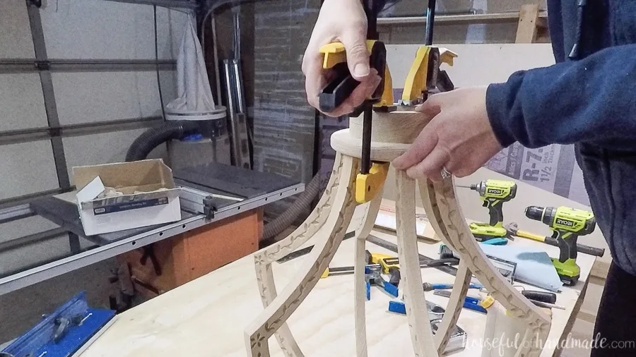 Glueing the top piece to the top of the DIY chandelier. 