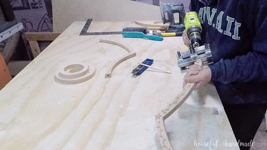 Drilling holes for dowels in the side pieces with a doweling jig.