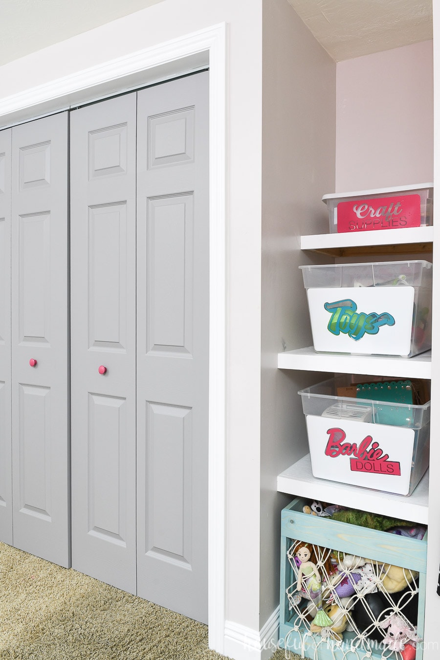 Side view of the closet with the gray painted doors shut. 