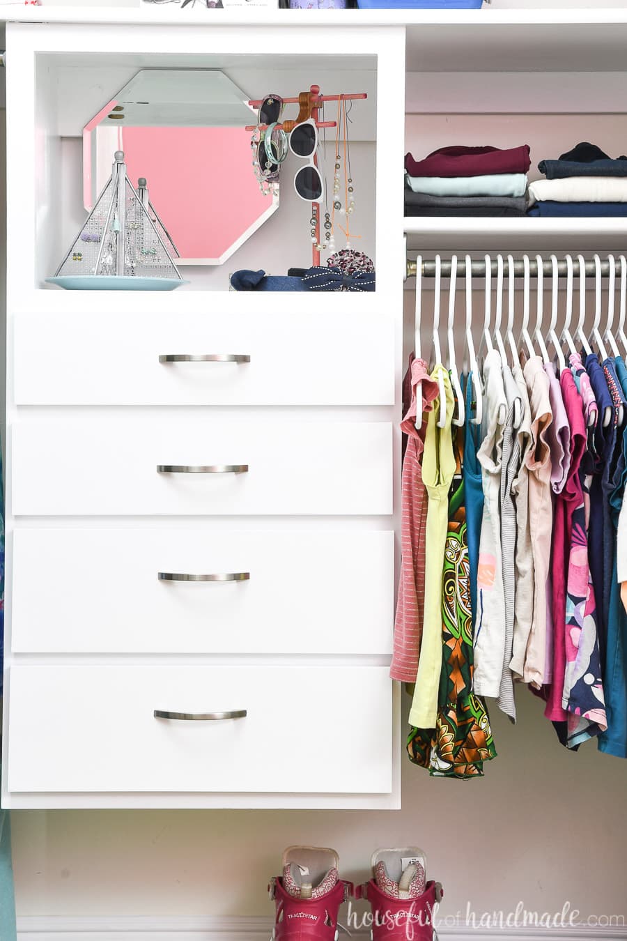 Close up of the DIY Closet Organizer built for the kids closet makeover. 