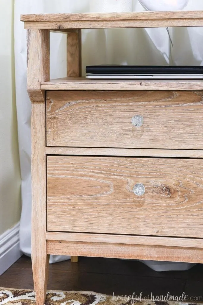 Close up of the grain of the white oak nightstands with liming wax finish to highlight the grain.