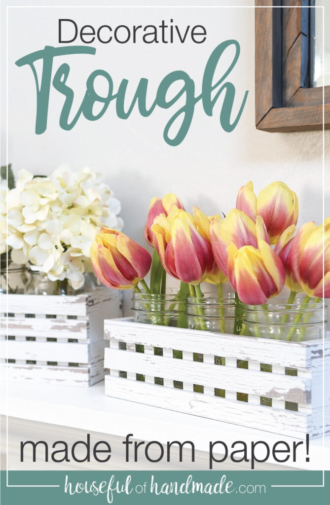 Farmhouse trough decor with flowers inside and text overlay.