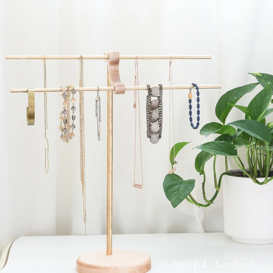 Gorgeous DIY necklace stand with brass rods.