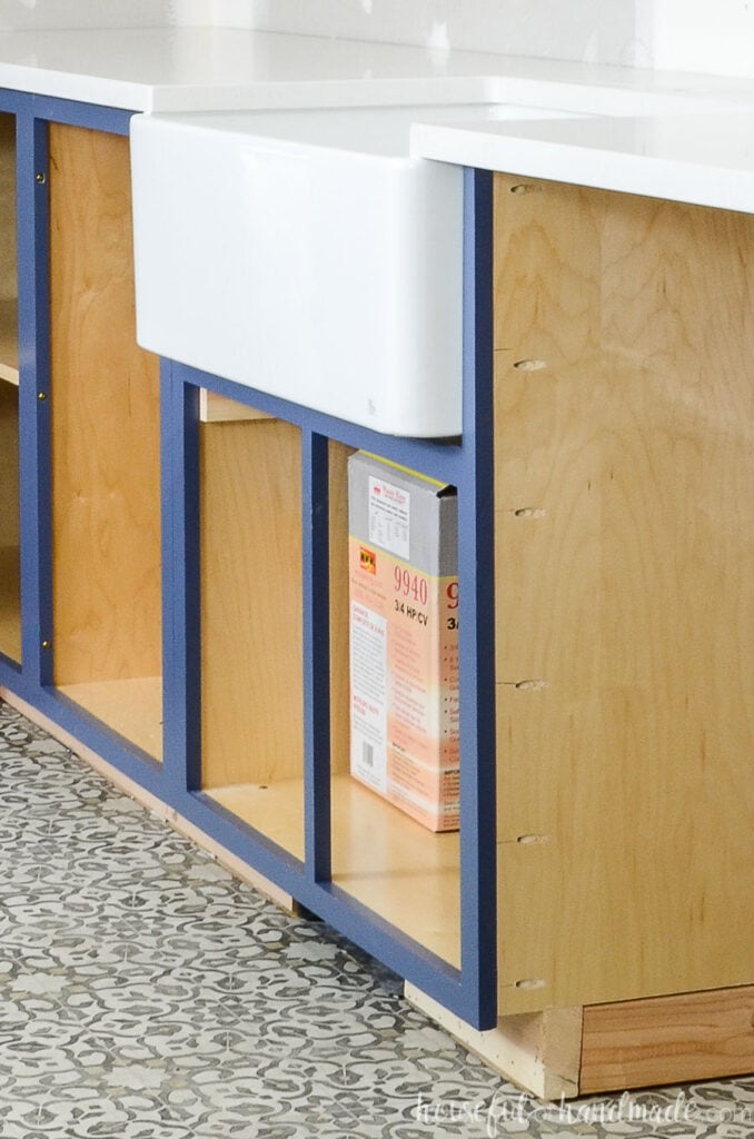 DIY kitchen cabinet installed with a farmhouse sink.