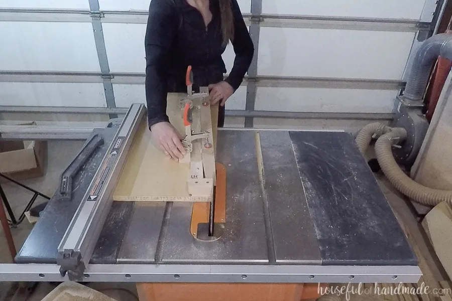 Cutting the forth side of the taper off on the table saw with the tapered leg jig.