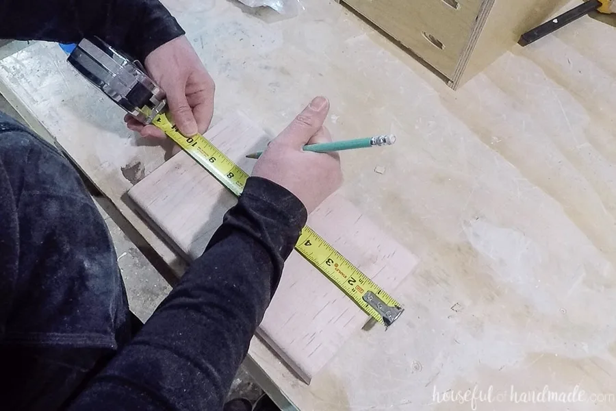 Marking the slots for the knives in the block.