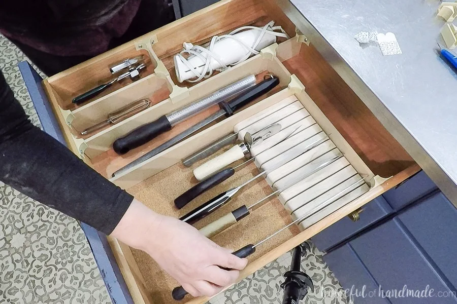 Loading up the drawer with knives and utensils after making the organizers for it.
