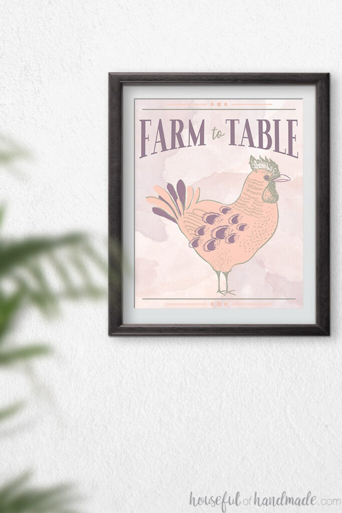 Black frame with rooster printable art in it.