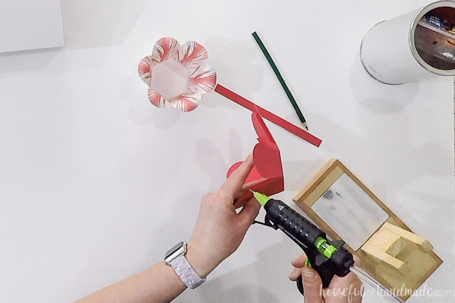 Glueing together the colored paper outer basket piece.