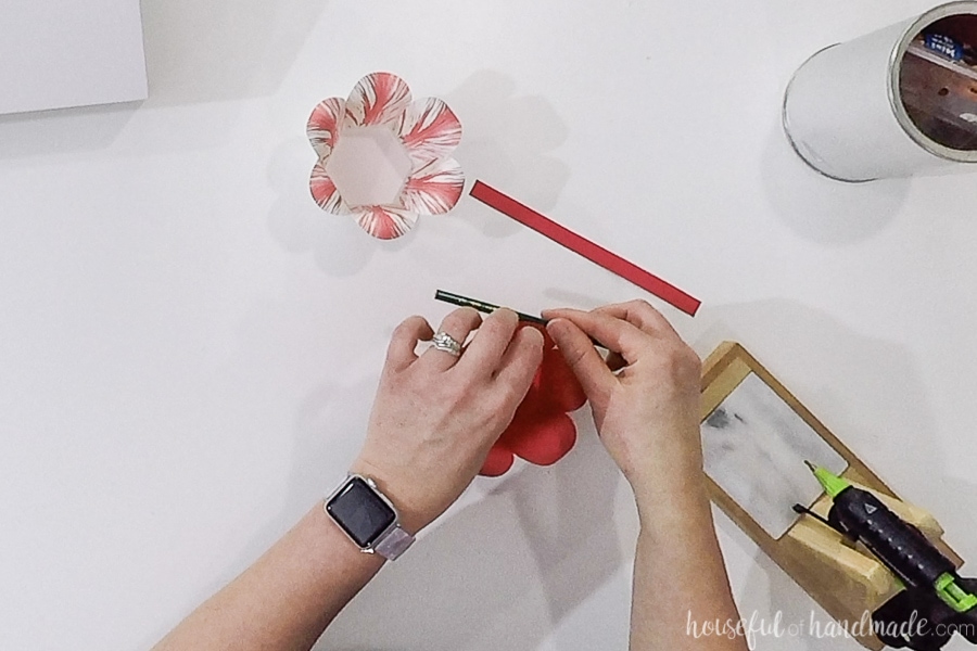 Curling over the petals on the outer basket.