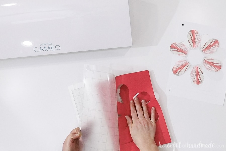 Removing the paper from the cutting mat.