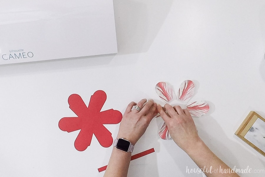 Folding along the dotted lines on the printed and cut flower basket.