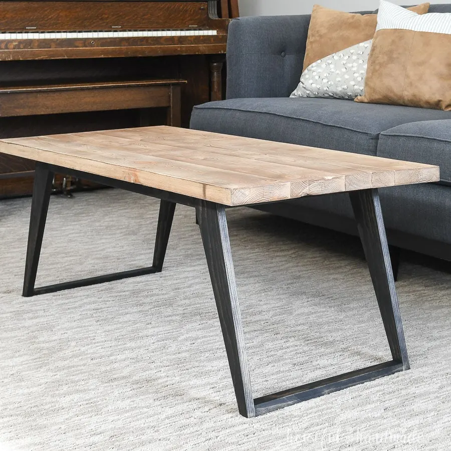 Close up view of the simple modern coffee table built from these free plans.