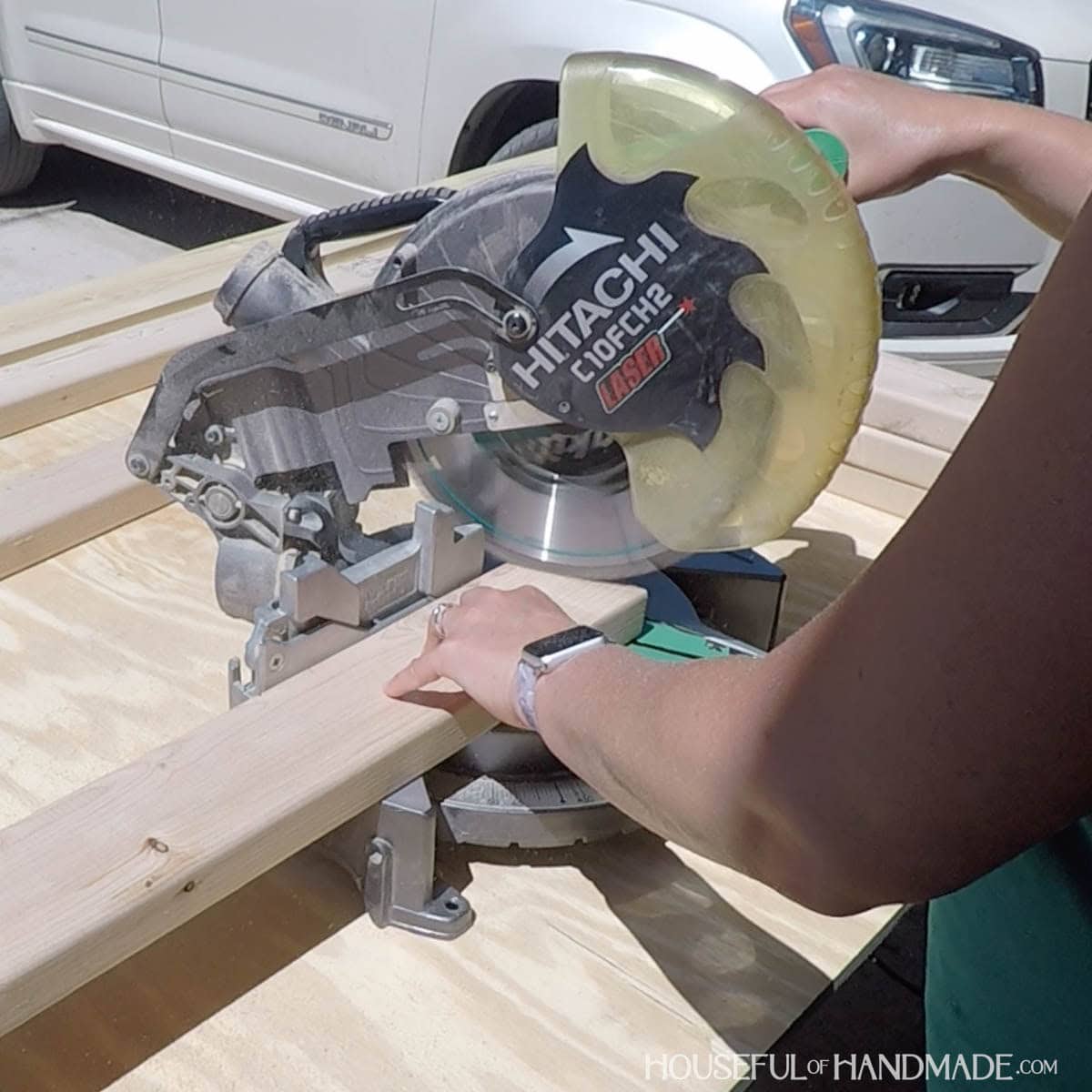 Cutting 2x4 on a miter saw.