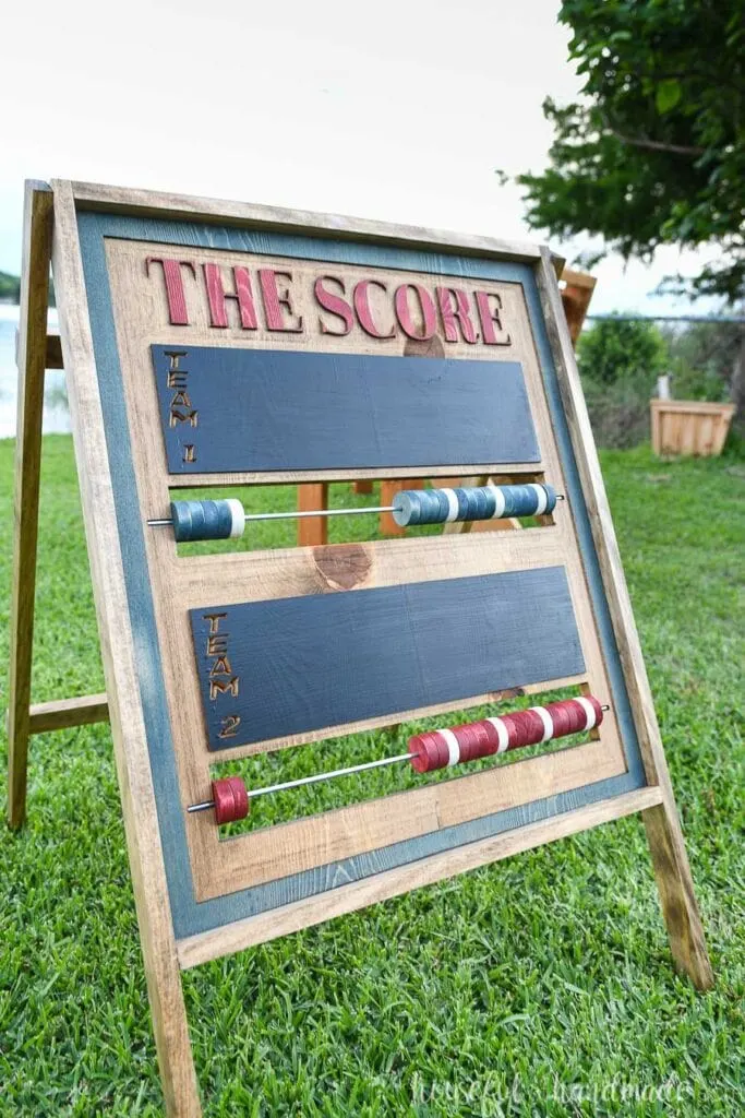 A-frame folding outdoor scoreboard with colored beads and chalkboard area for team names.