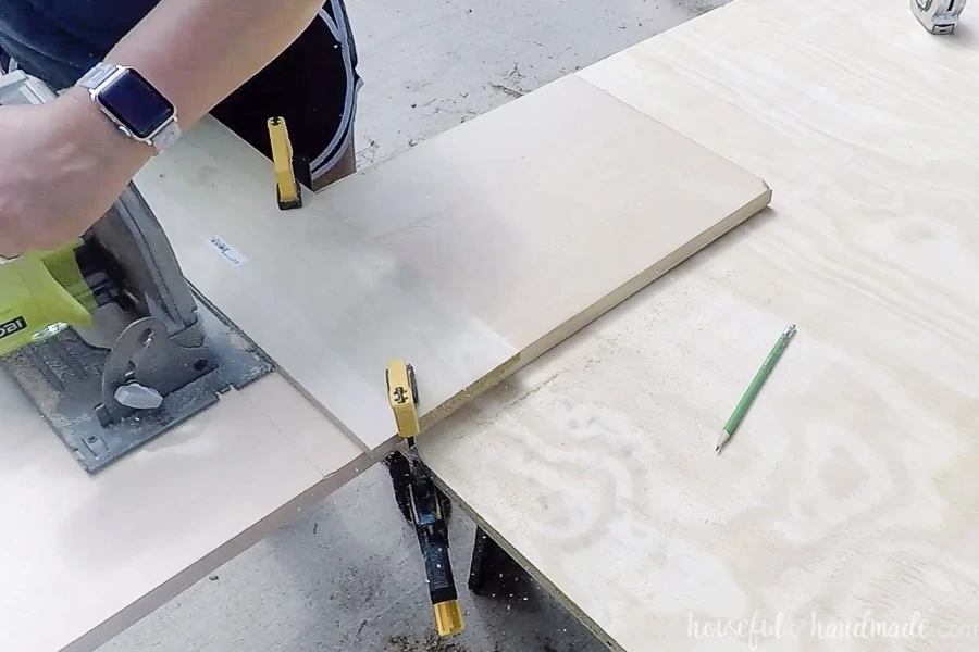 Cutting the 1x12 board with a circular saw. 