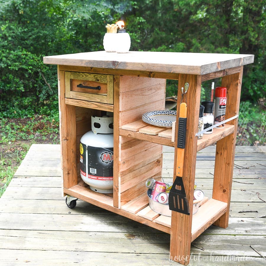 Rilling grill side cart with storage for accessories, spices, fuel tank and more.