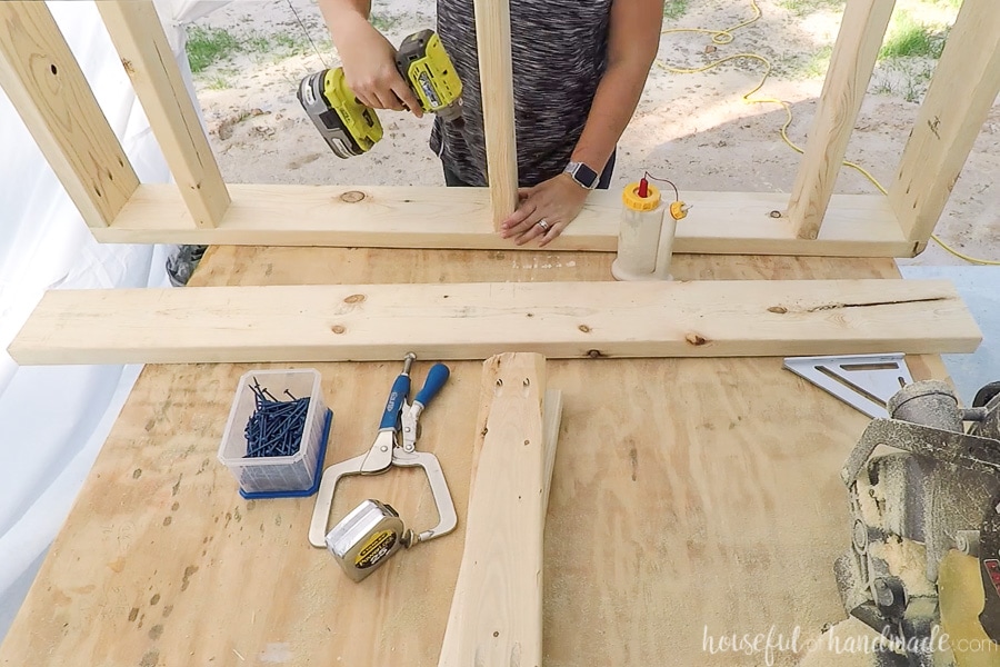 Attaching the center 2x4 board to the 2x6 frame with pocket holes. 