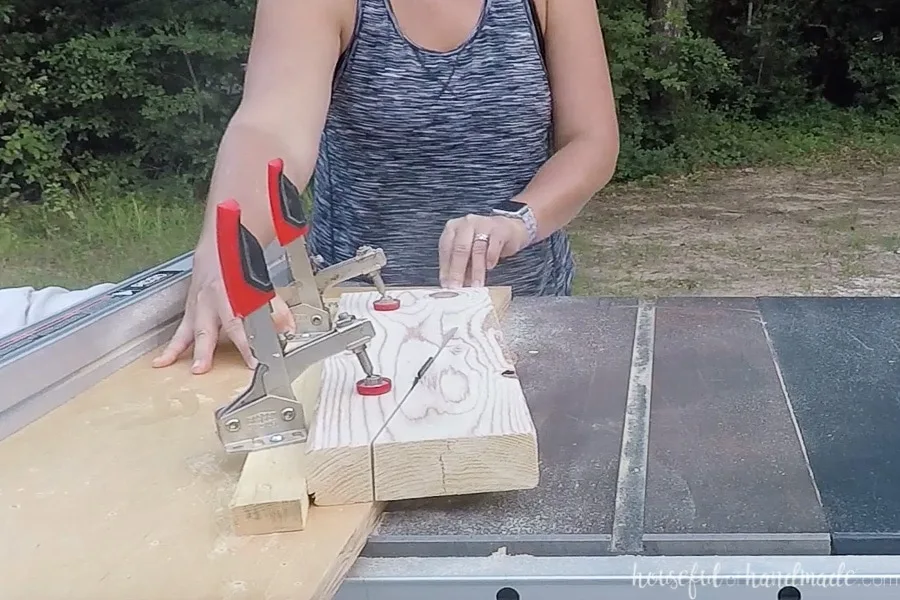 Cutting the angle on the back rests of the benches with a table saw jig. 