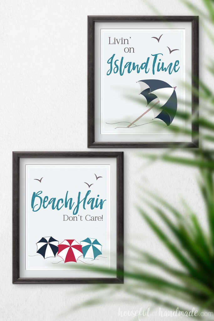 Two beach printables in black frames on the wall.