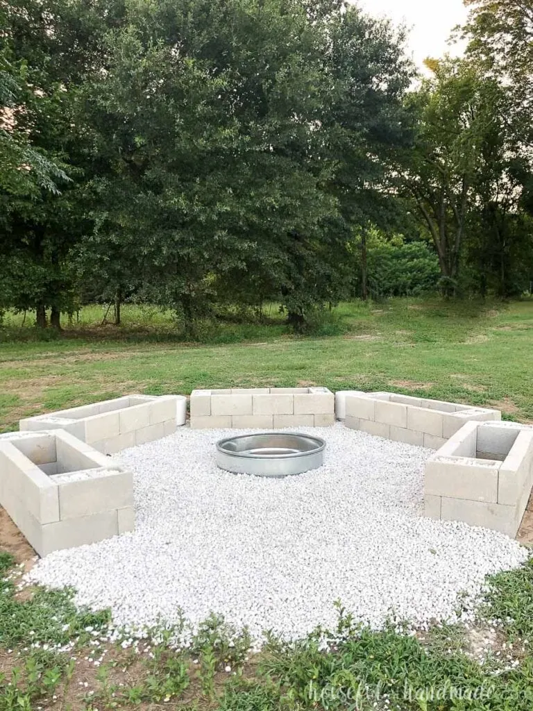Fire cinder block bases in a hexagon shape with an opening where the 6th base would go with a fire pit in the center. 