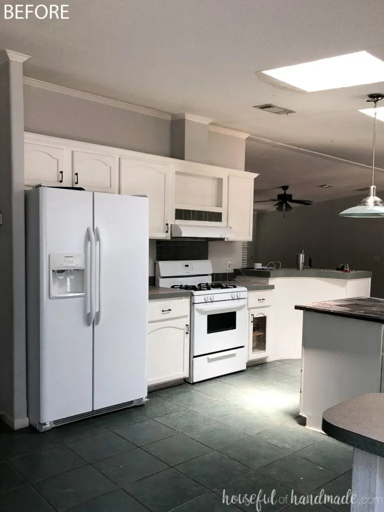 Before photo of the fridge & stove side of the kitchen. 