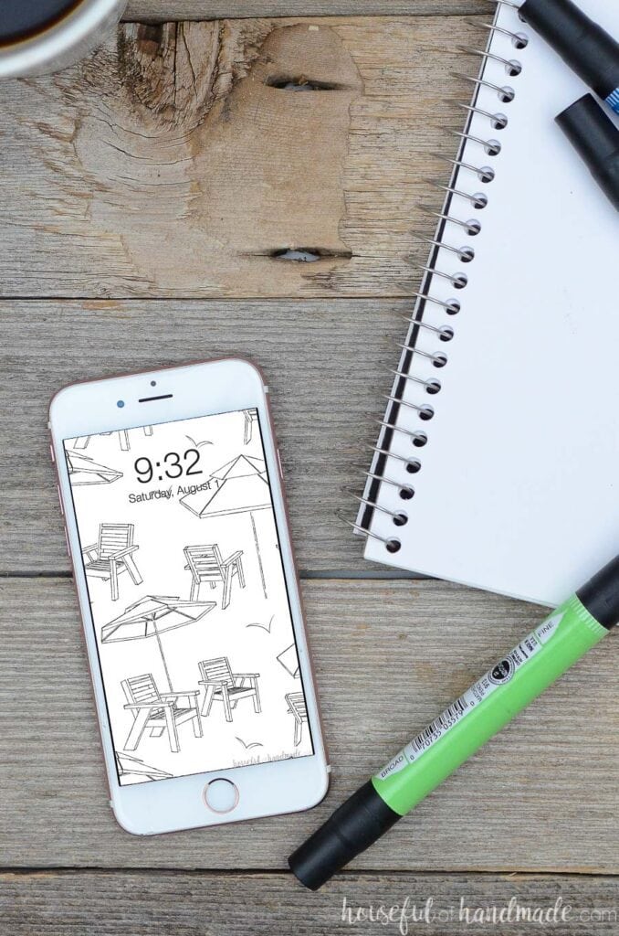 white iPhone with black & white beach umbrella and chair sketch pattern for digital wallpaper.