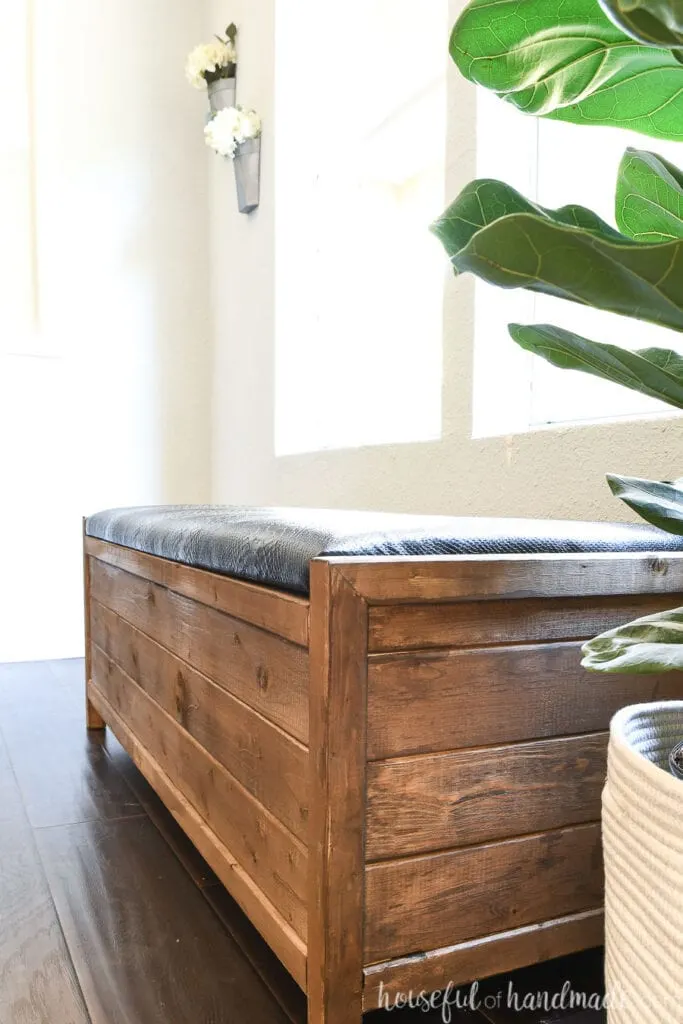 Close up of the side profile of the DIY upholstered storage bench.