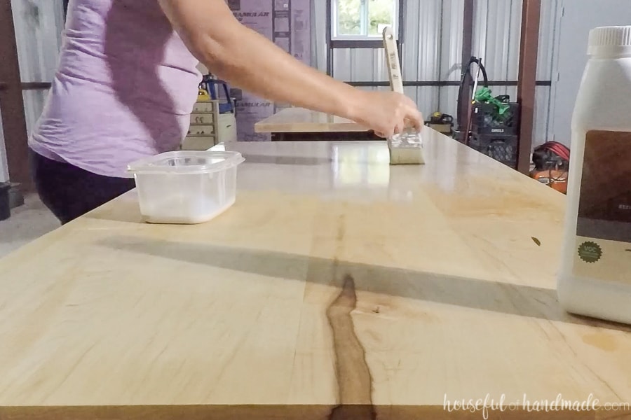 Applying the second coat of H2OLOX finish to the top of the wood countertops. 